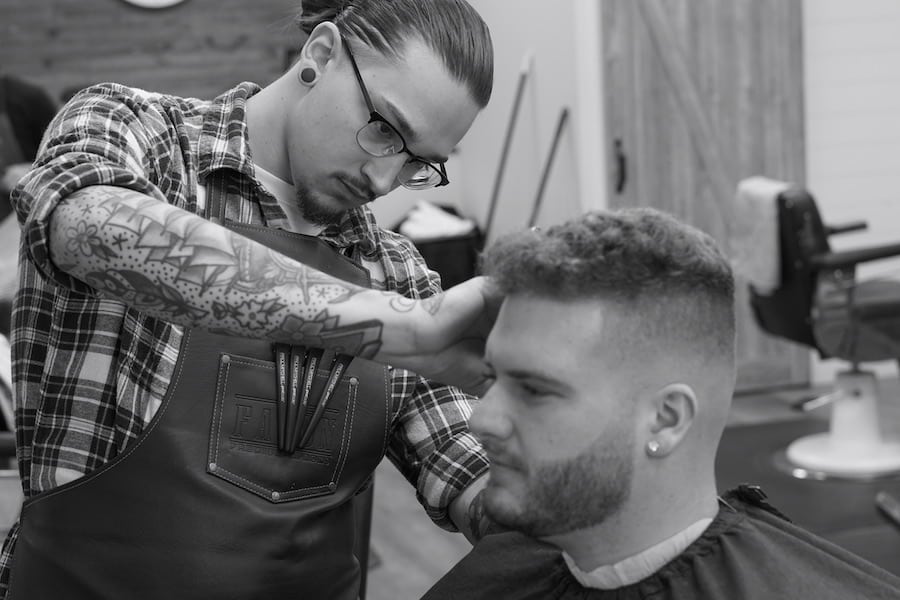 picture of a man cutting another man's hair